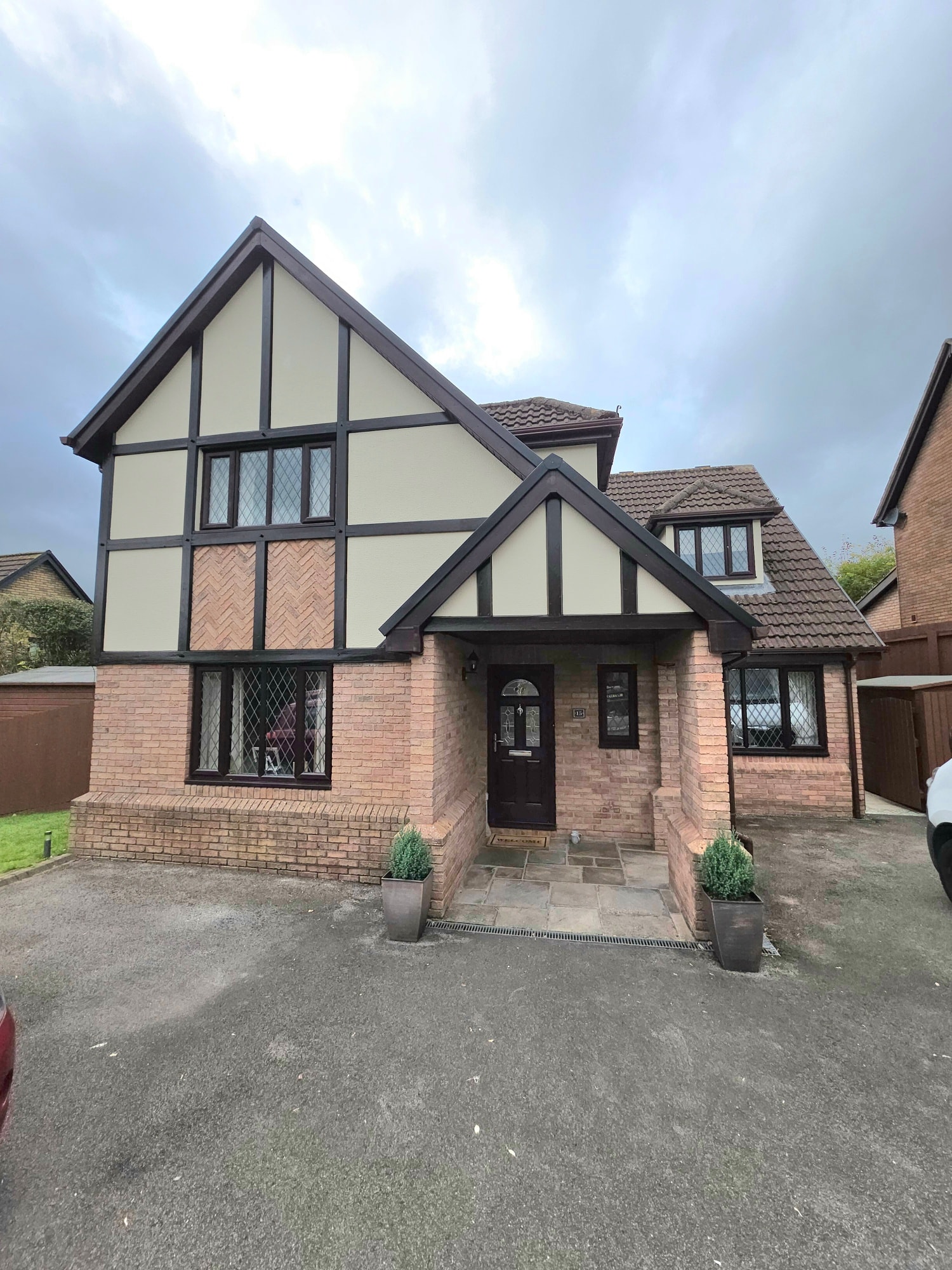 Front elevation of detached home after full exterior repaint — Newport