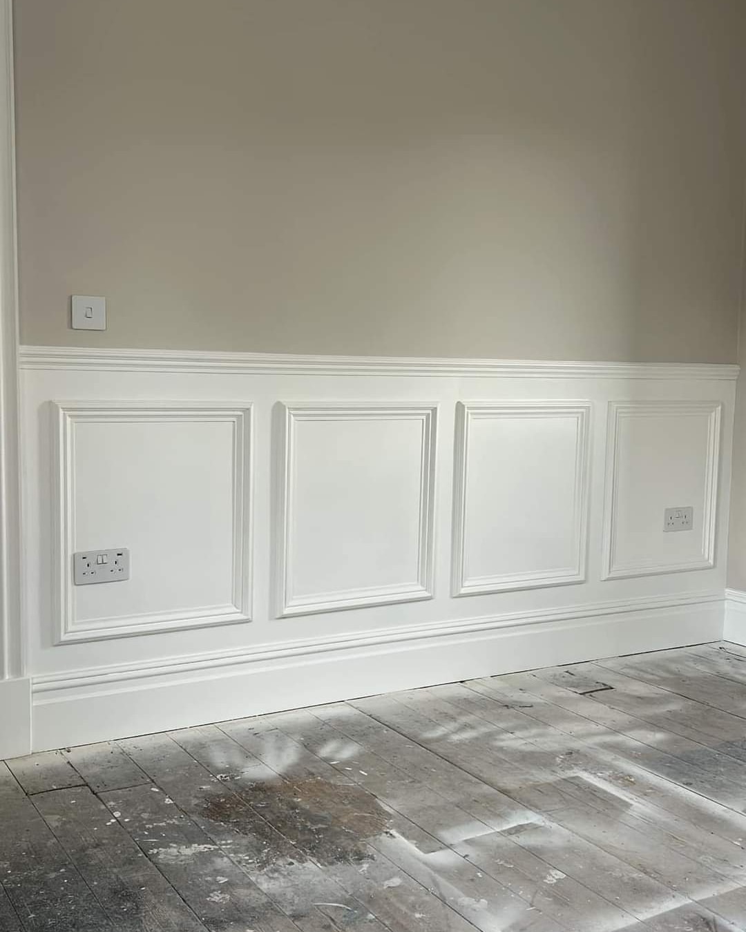 Crisp white wall panelling and skirting in beige hallway — South Wales woodwork painting