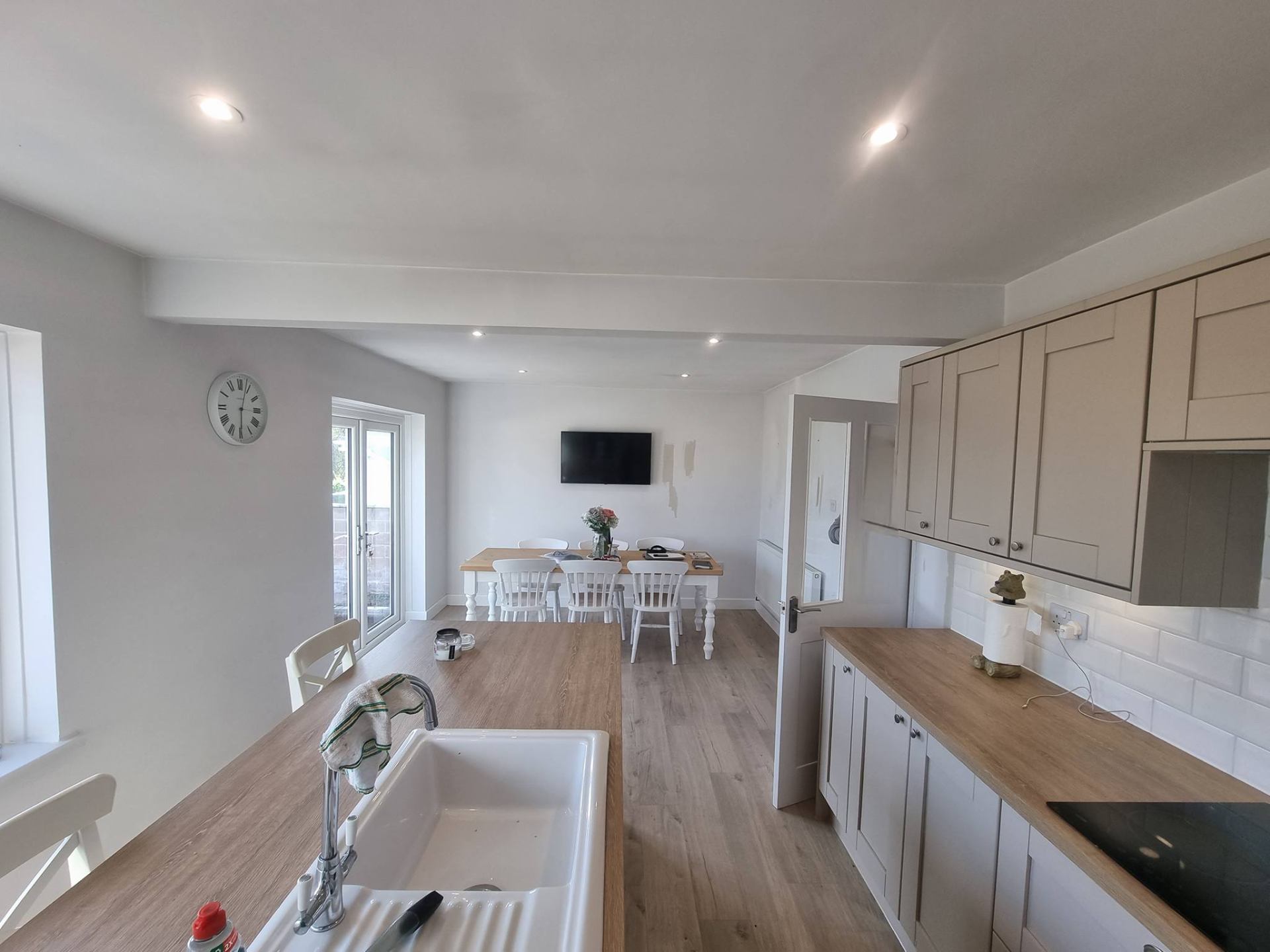 Newly painted utility kitchen in a soft cream finish
