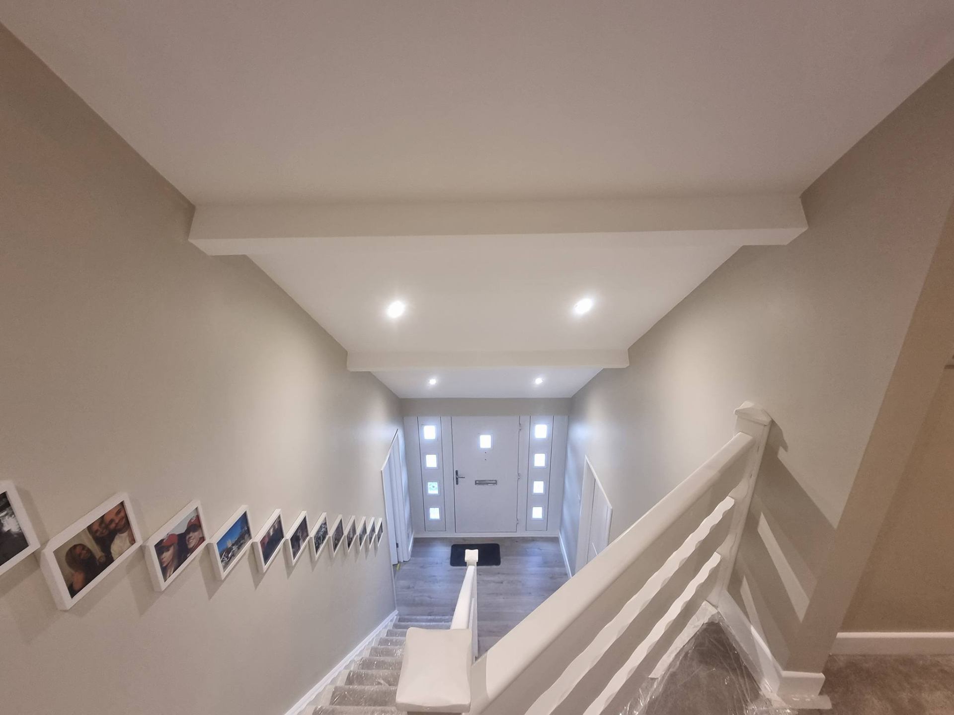 Freshly painted Newport hallway with skylit ceiling and crisp white woodwork