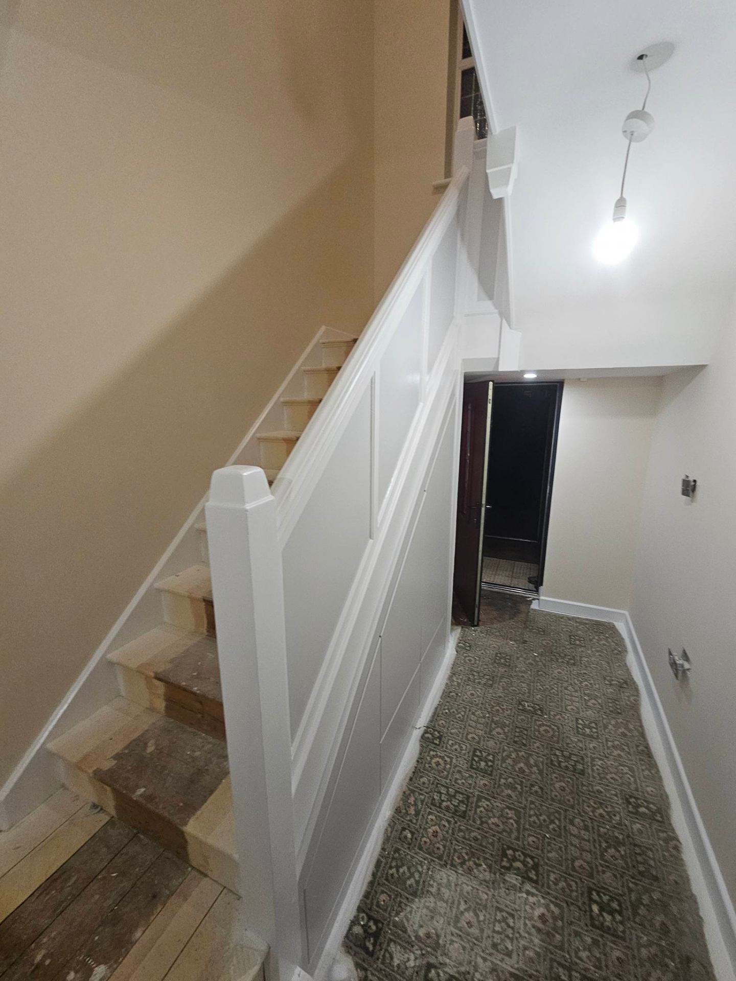 Refreshed living space with newly painted walls and woodwork