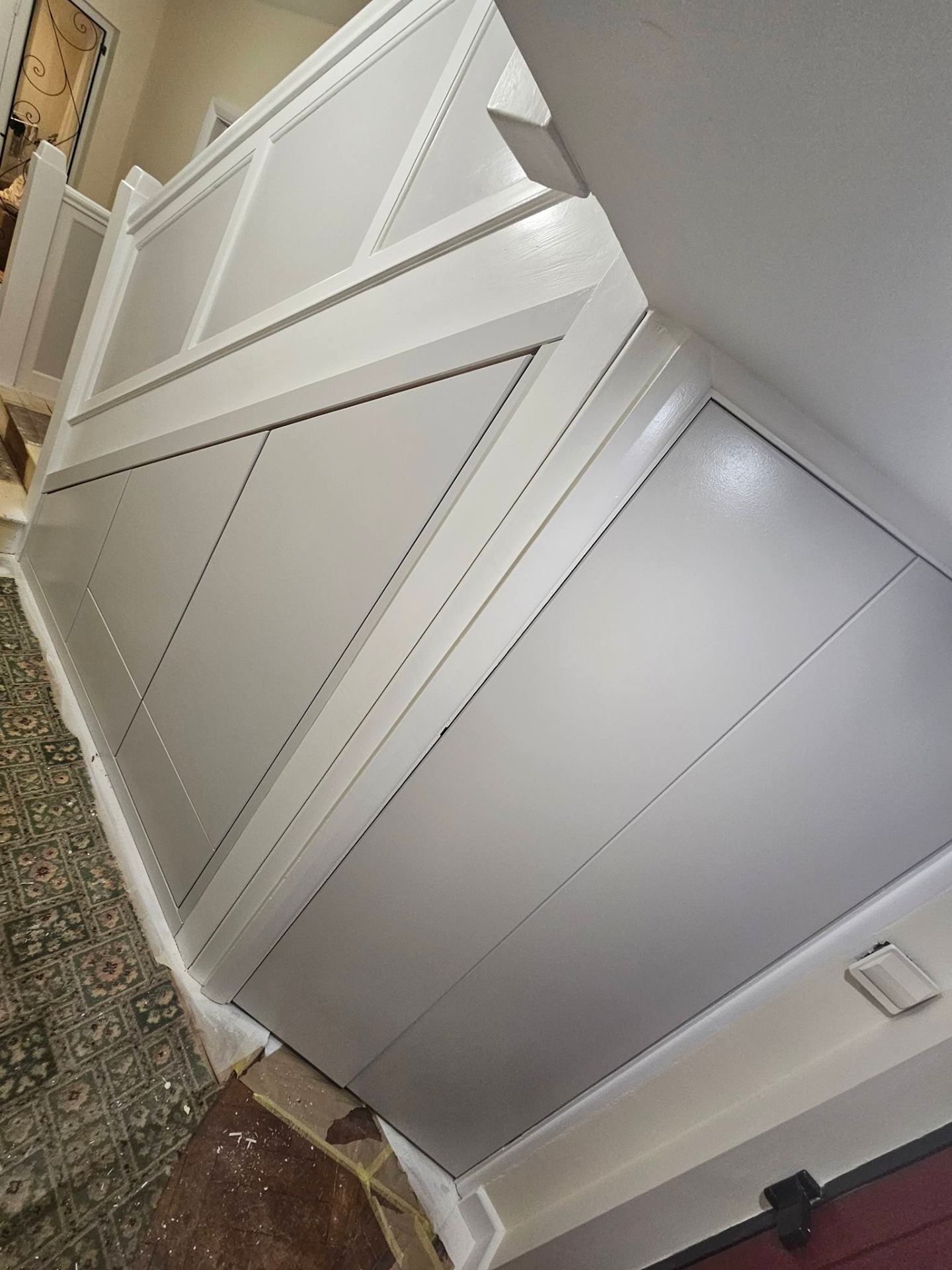 Modern hallway after professional repaint with sharp cut-ins to ceiling