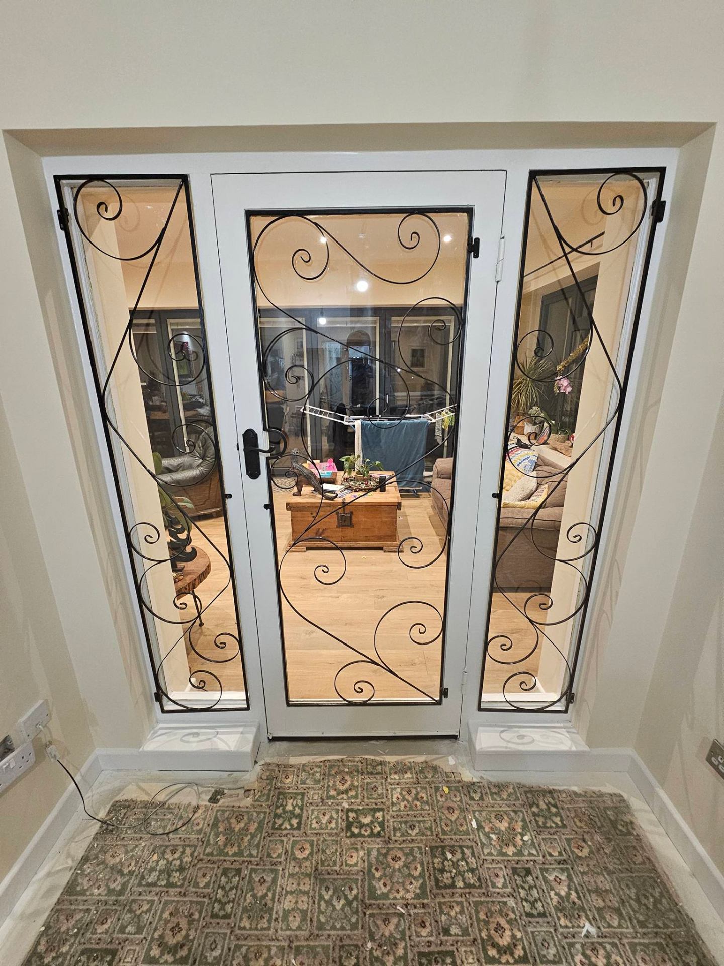 Painted wrought-iron-style French doors with crisp finish