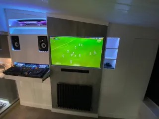 Sprayed bespoke media wall with crisp grey lacquer finish