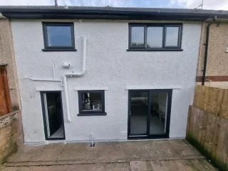 Smooth white render rear extension after full repaint